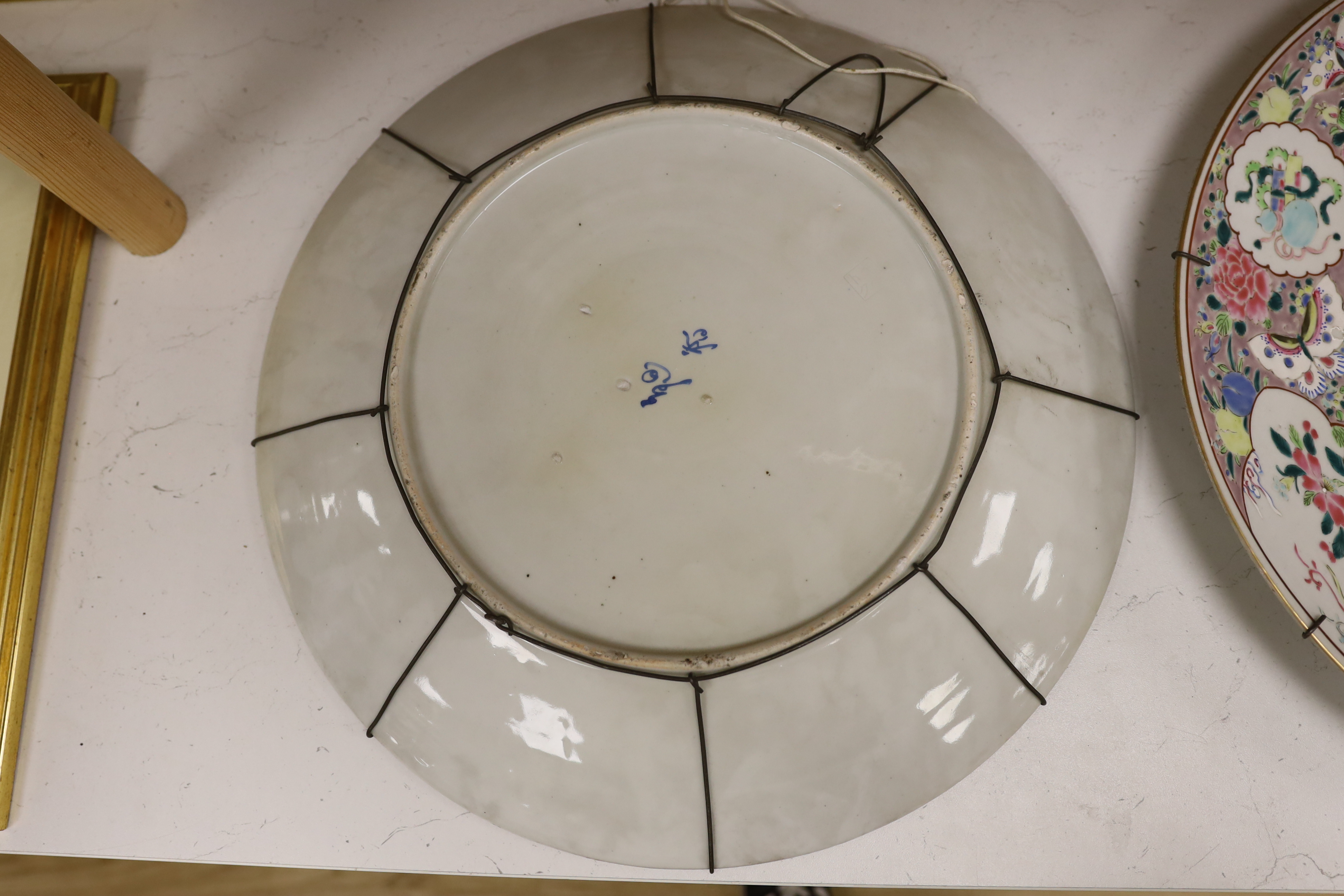 A pair of early 20th century Japanese porcelain chargers, 46cm diameter
